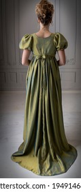 A Young Regency Woman Wearing A Silk Dress Shown In Back View
