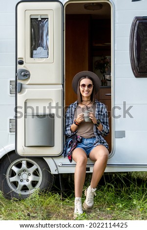 Similar – Image, Stock Photo Woman standing in ladder opening tent over car