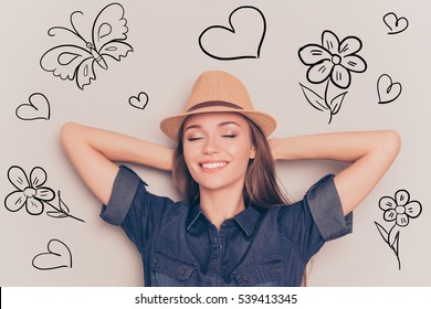 Young Relaxed Woman With Closed Eyes Touching Head And Dreaming