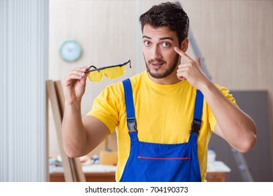 Young repairman carpenter working cutting wood - Powered by Shutterstock