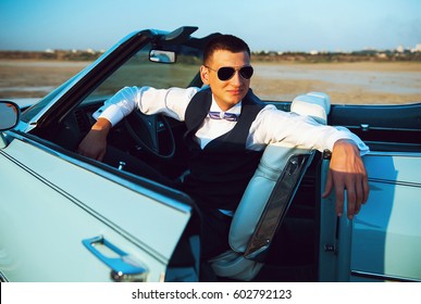 Young representative kind of guy driving a rarity car