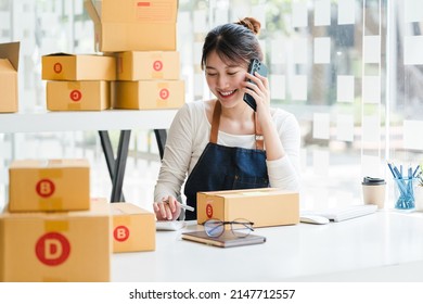 Young Retail SME Asian Businesswoman Call The Phone To Negotiate The Price Of The Product And The Delivery Fee.