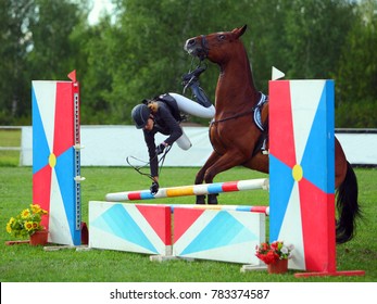 Young Rider Falling From Horse During A Competition