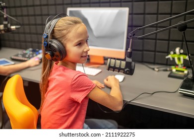 Young RJ Talking Into The Microphone During The Radio Show