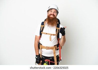 Young rock- climber reddish caucasian man isolated on white background pointing to the side to present a product - Powered by Shutterstock