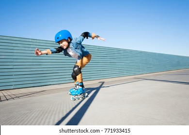 Young roller skater riding fast at rollerdrom