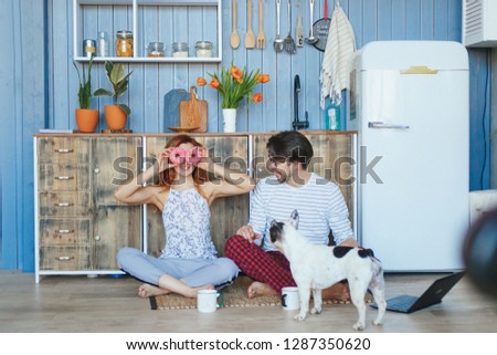 Young romantic couple at home in the kitchen