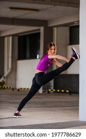 Young Runner Fit Woman Streching Before Exercises Outdoors. Athletic Female Strech After Workout Outside. Sport And People Concept.