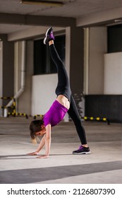 Young Runner Fit Woman Streching Before Exercises Outdoors. Athletic Female Strech After Workout Outside. Sport And People Concept.