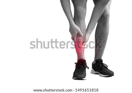 young runner is suffering from shin splints 
