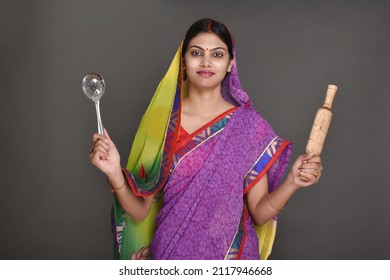 Young Rural Woman Holding Rolling Pin 