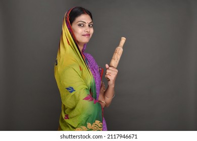 Young Rural Woman Holding Rolling Pin 