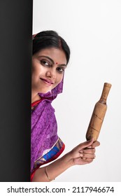 Young Rural Woman Holding Rolling Pin 