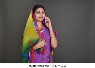 Young rural woman talking on mobile phone 