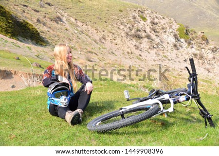 Young Russian girl in the mountains