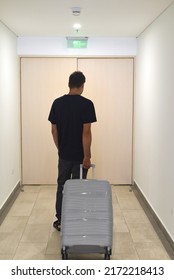 A Young Russian Man Going Away With Suitcase. Russian Emigration Concept