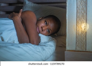 Young Sad And Depressed Black African American Woman In Bed Sleepless Late Night Feeling Desperate Looking Worried And Anxious Suffering Depression Problem And Insomnia Sleeping Disorder