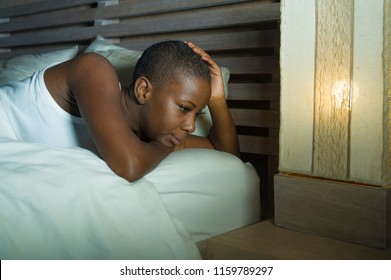 Young Sad And Depressed Black African American Woman In Bed Sleepless Late Night Feeling Desperate Looking Worried And Anxious Suffering Depression Problem And Insomnia Sleeping Disorder