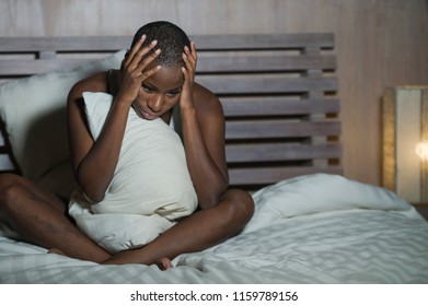 Young Sad And Depressed Black Afro American Woman In Bed Sleepless Late Night Feeling Desperate Looking Worried And Anxious Suffering Depression Problem And Insomnia Sleeping Disorder