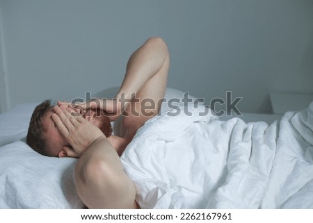 Similar – a girl with her hair by her face lying on the bed