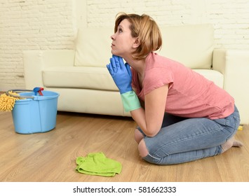 Young Sad And Desperate Housewife Or Woman Stressed And Tired Cleaning The House Washing The Floor On Her Knees With Cloth And Bucket Praying In Domestic Home Work Stress And Housework