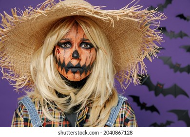 Young Sad Dissatisfied Frustrated Weary Woman 20s With Halloween Makeup Mask In Straw Hat Scarecrow Costume Isolated On Plain Dark Purple Background Studio Portrait Celebration Holiday Party Concept.