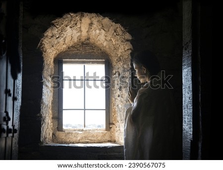 Young sad upset scare worry male Jewish human man face see ask god light faith hope dream love. Teen kid lady stand dark black prison fort house home room wall feel fear bore pain grief war text space
