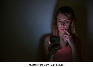 Young Sad Vulnerable Girl Using Mobile Phone Scared And Desperate Suffering Online Abuse Cyberbullying Being Stalked And Harassed In Teenager Cyber Bullying Concept