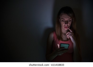 Young Sad Vulnerable Girl Using Mobile Phone Scared And Desperate Suffering Online Abuse Cyberbullying Being Stalked And Harassed In Teenager Cyber Bullying Concept