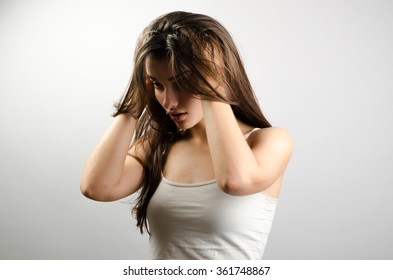 Young Sad Woman Holding Head