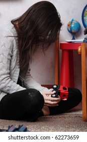 Young Sad Woman (mother) Sitting In Children Room (lost Of Child Concept)