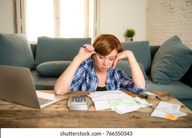 Young Sad Worried And Desperate Woman Banking And Accounting Home Monthly And Credit Card Expenses With Computer Laptop Doing Paperwork In Living Cost Stress And Paying Bills Problem