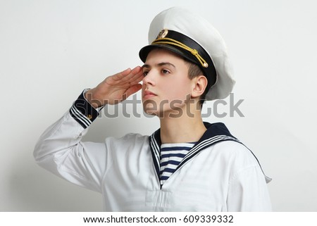Young sailor posing on white background
