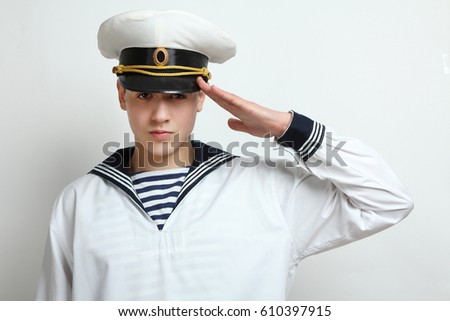 Young sailor posing on white background