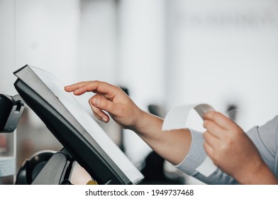 Young Saleswoman Doing Process Payment On Touchscreen POS, Counting Sale In The Cash Register, Finance Concept