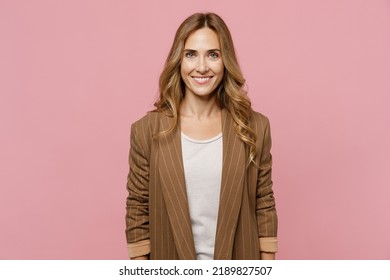 Young satisfied smiling happy fun cheerful successful european employee business woman 30s she wearing casual classic jacket look camera isolated on plain pastel light pink background studio portrait - Shutterstock ID 2189827507