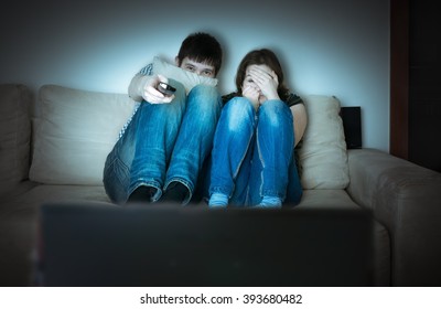 Young Scared Couple Is Watching Horror On TV.