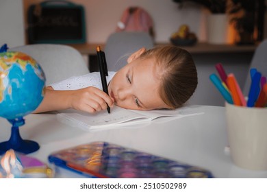 Young school boy having trouble with his homework. Cute little school girl studying at home, having difficulties completing homework.  - Powered by Shutterstock