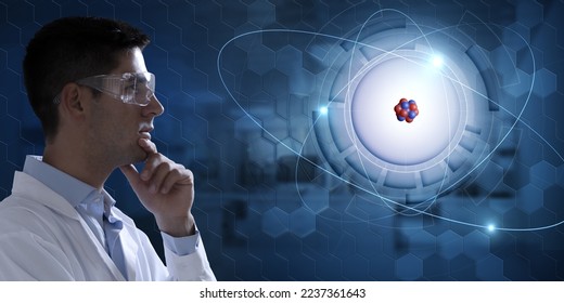 Young scientist analysing holographic atomic structure: glowing electrons orbiting around nucleus. Concept of  breakthrough in nuclear physics. 3d rendering element. - Powered by Shutterstock