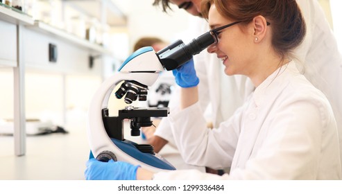 Young Scientist Looking Through Microscope Laboratory Stock Photo (Edit ...