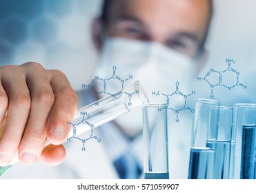 Young Scientist Mixing Reagents In Glass Flask In Clinical Laboratory