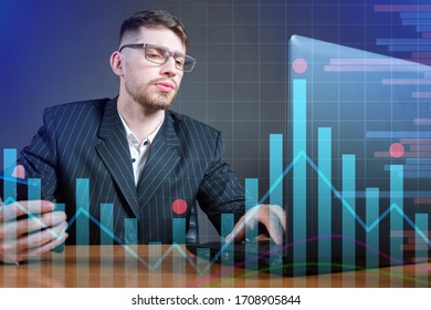 Young scientist on the background of graphs. Dynamics of economic indicators. Statistics. Exchange trade. Mathematical analysis. A man at a laptop against the background of stock information.