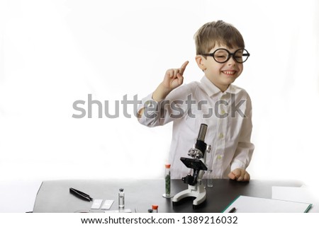 Similar – Image, Stock Photo boy is making science experiments in a laboratory