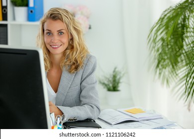 Young Secretary Working Hard In Office