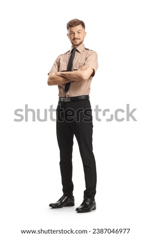 Young security officer posing with folded arms isolated on white background