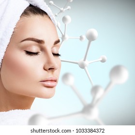 Young sensual woman with big white molecule chain. - Shutterstock ID 1033384372