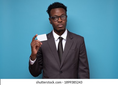 Young Serious African Businessman Holding Credit Card