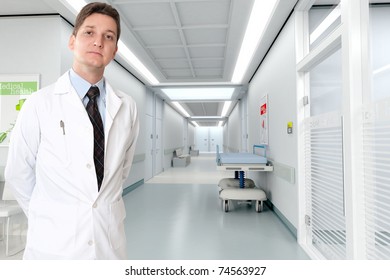 Young Serious Doctor Standing By A Hospital Corridor