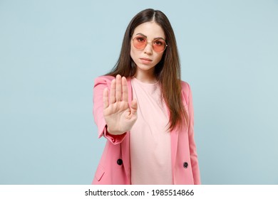 Young Serious Strict Stylish Fashionable Woman 20s Wearing Pastel Pink Clothes Glasses Do Stop Palm Gesture Say No Refusing Isolated On Blue Color Background Studio Portrait People Lifestyle Concept