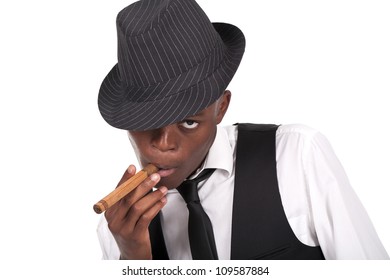 Young And Sexy Black Man Wearing A Hat And Smoking A Cigar